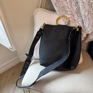 Black purse with gold handle